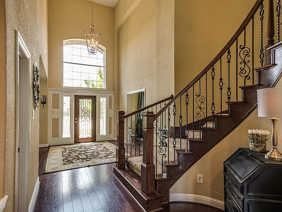 This elegant two story foyer is sure to impress.