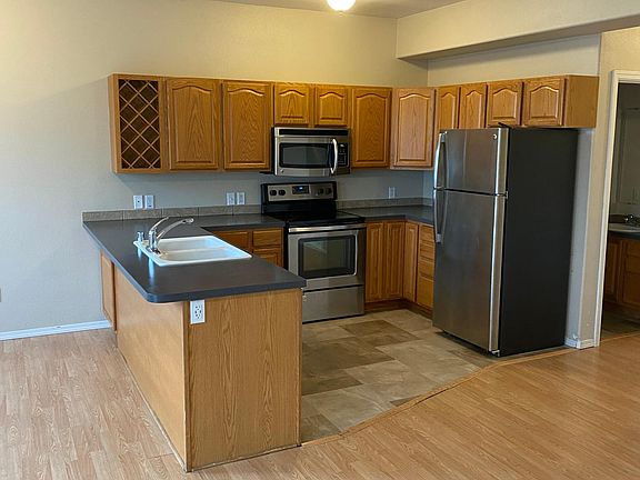 Kitchen with stainless steel appliances including dishwasher
