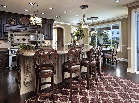 Kitchen is a designers dream! Extremely detailed with highest of craftsmanship. 9 ft. contrasting island. Viking Range, Sub Zero