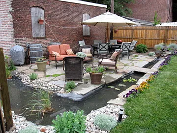 22. Yard w/ raised bed and lots of planting around