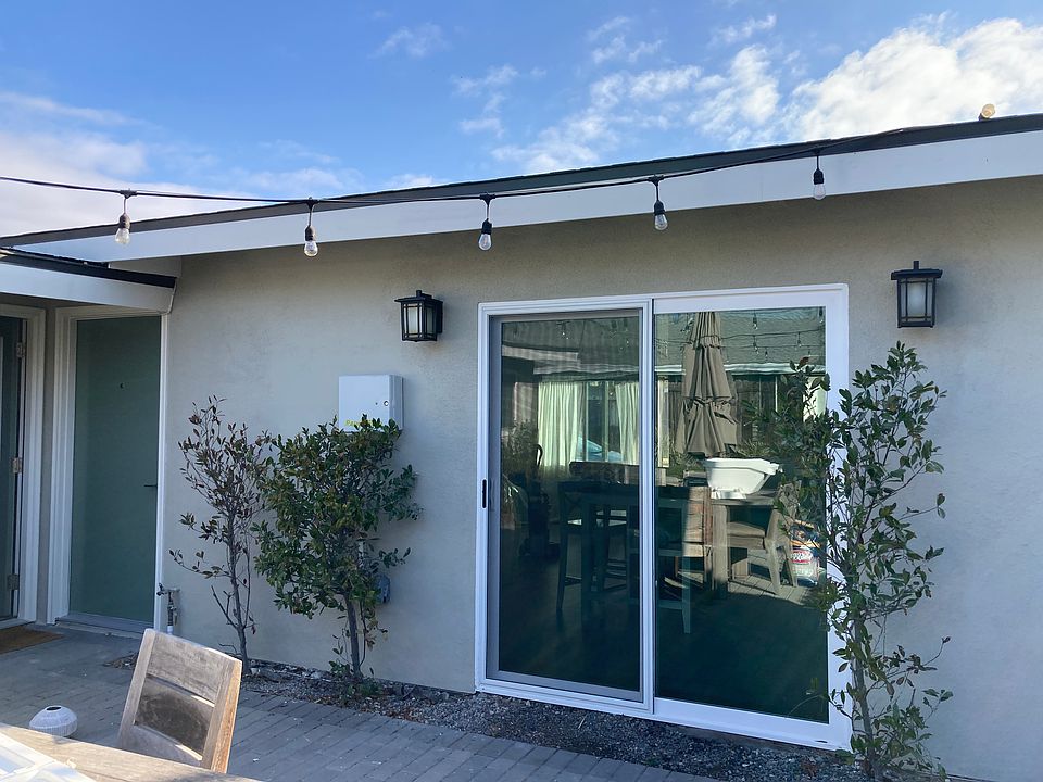 Front door and sliding doors to patio