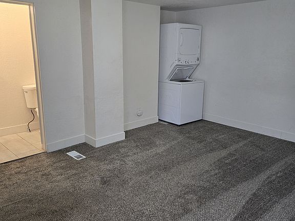 View of Washer/Dryer and bathroom from Front Door