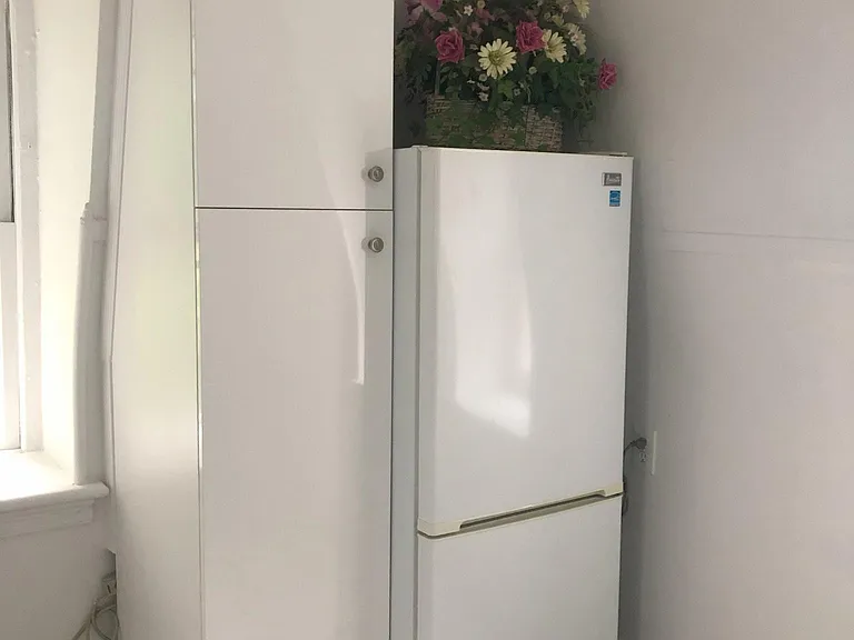Another vertical kitchen cabinet.