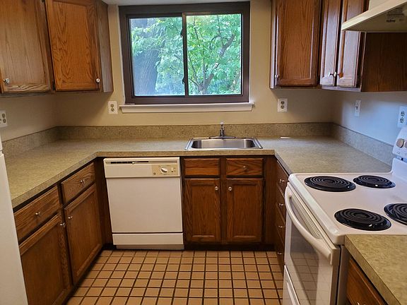 Kitchen with lots of wood cabinets and counter space, ceramic tile floor