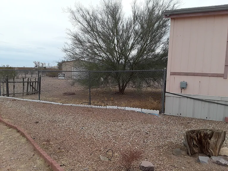 Front of House with side entrance to Backyard.