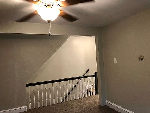 Livingroom w/open staircase 