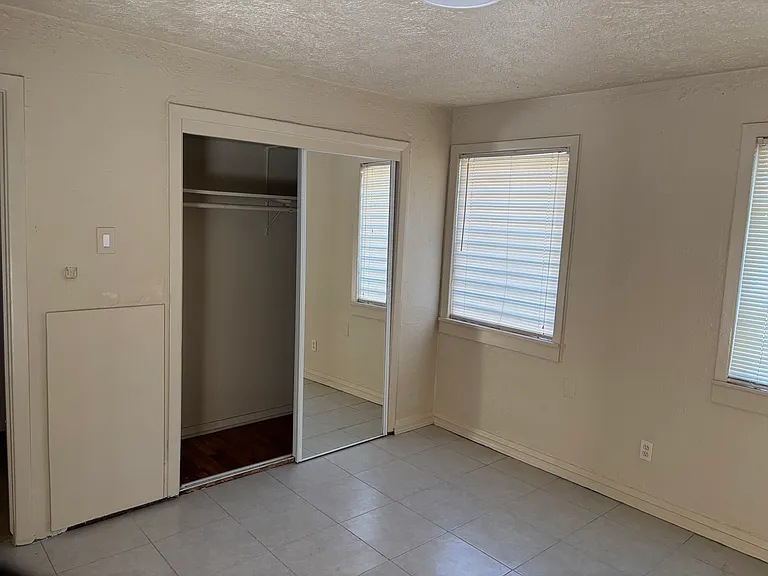 2nd bedroom with tiled floors.