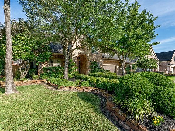 Lush landscape and mature trees offers such great curb appeal to this home.