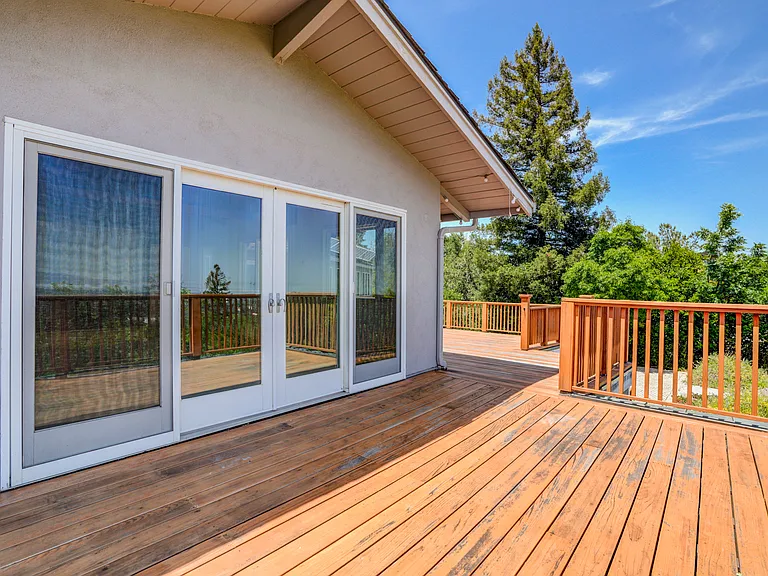 Wonderful rear upper deck beckoning for entertainment or relaxation, offering a spectacular view of the bay.
