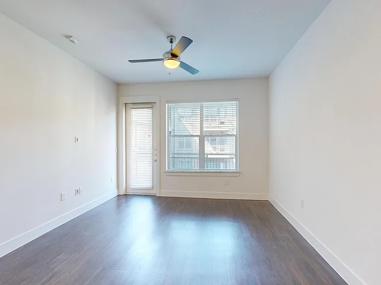 Apartment living room with wood-style flooring.
