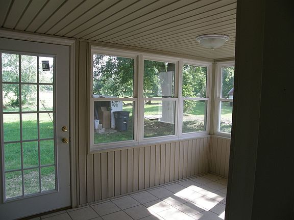 Sunroom with tile floor