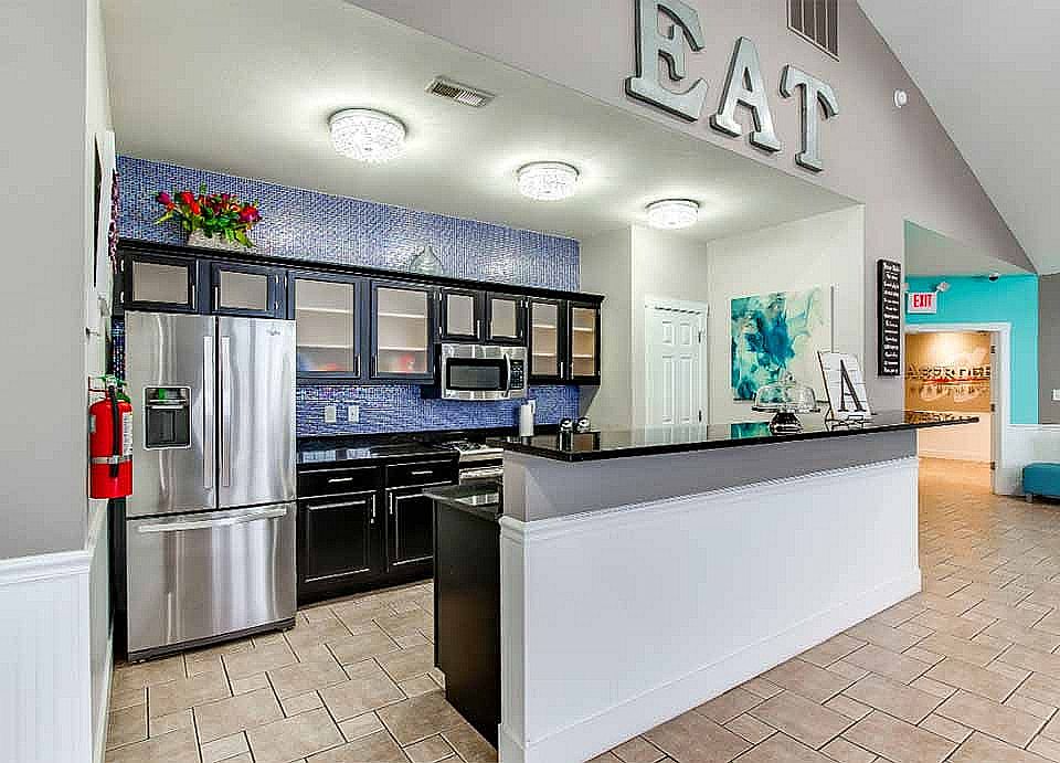 The clubhouse's full kitchen and coffee bar are available for residents to use.
