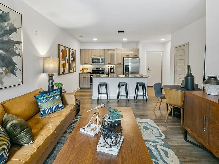 Enjoy a cozy yet modern atmosphere with stylish furnishings, open layout, and a kitchen that's made for gathering.