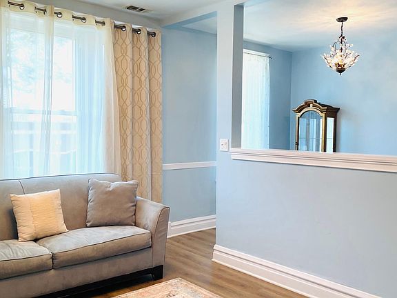 Open air front entryway into living room.