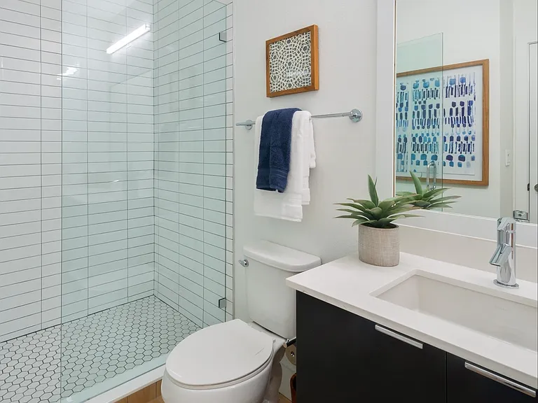 Walk-in showers with rainfall showerheads in select floorplans