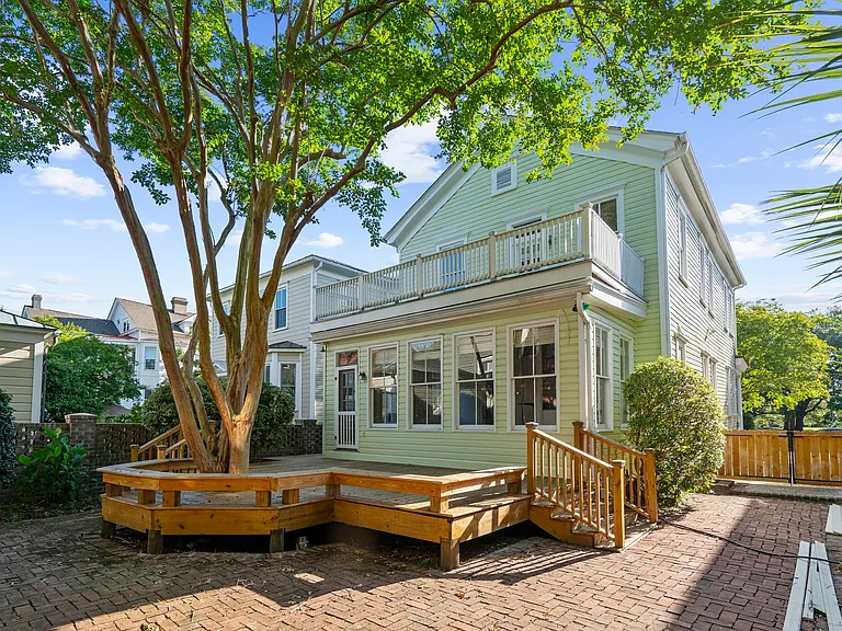 Back of the House with Deck and Brickyard with Landscaping