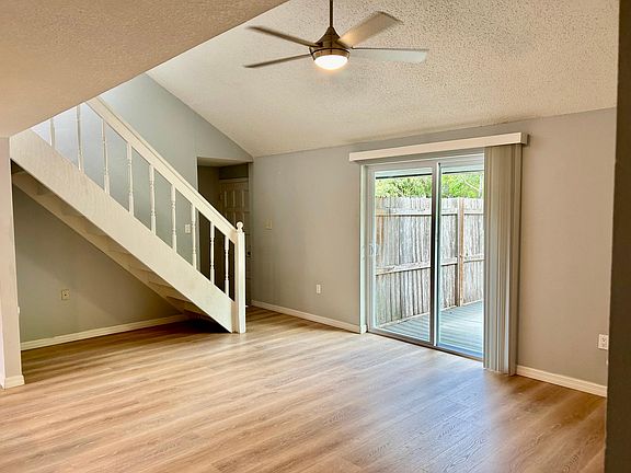 Slider to the yard and stairs to the primary bedroom and bath