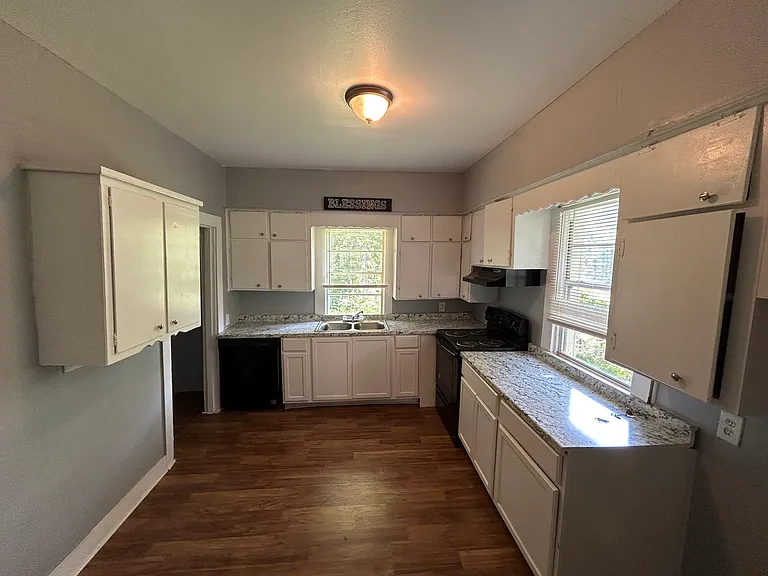 Big kitchen with granite counters.