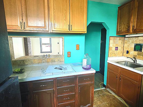 Large kitch with fridge and eating nook