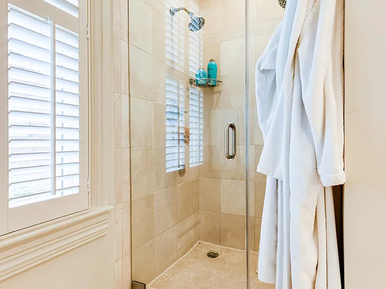 Glass shower in master bathroom.