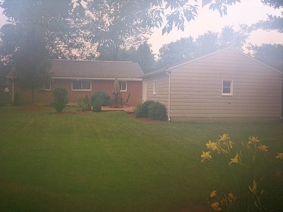 View a backyard. Rear of lot abuts woods, not another property.
