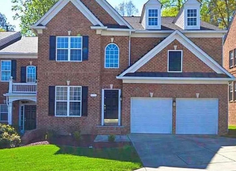 Brick Townhome with a 2 Car Garage.