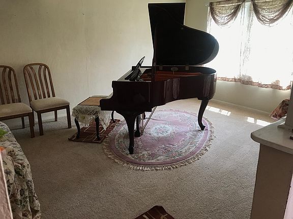 1st level living space currently with a piano