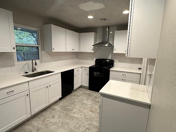 New tile in kitchen and stainless vent hood