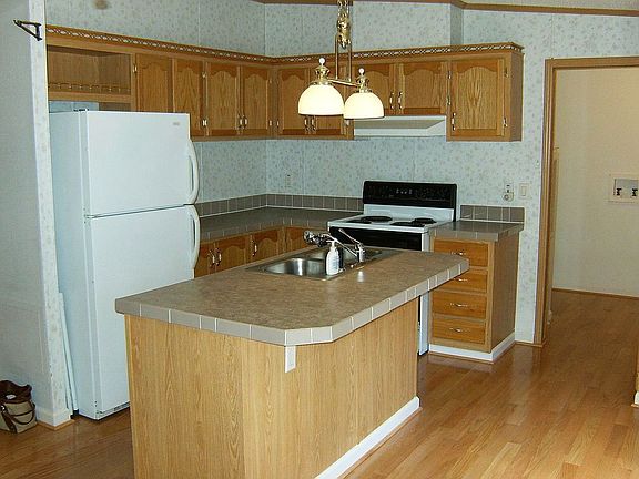 Kitchen includes frig, dish-w  and stove.  Engineered oak flooring is new.
