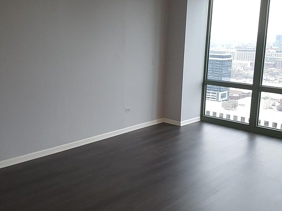 This will be the NEW FLOORING installed before Tenant moves in- WALL COLOR is the Gray Tones like in this unit (photo from another Unit of Owners)