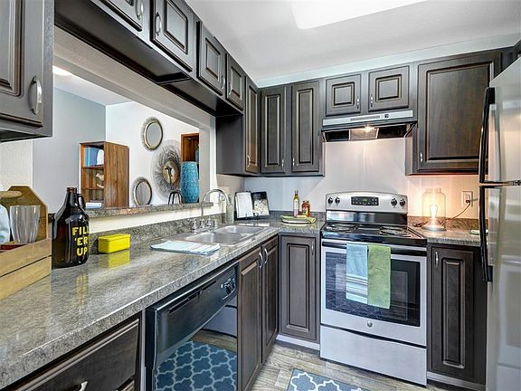 Newly renovated kitchens with silver appliances as well as n