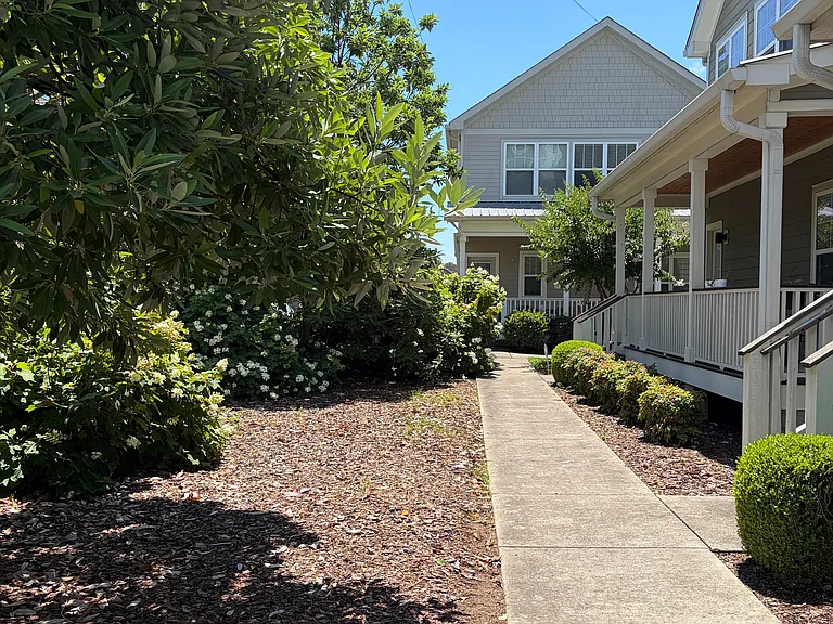 View of the house from one of the private HOA walkways in the courtyard.