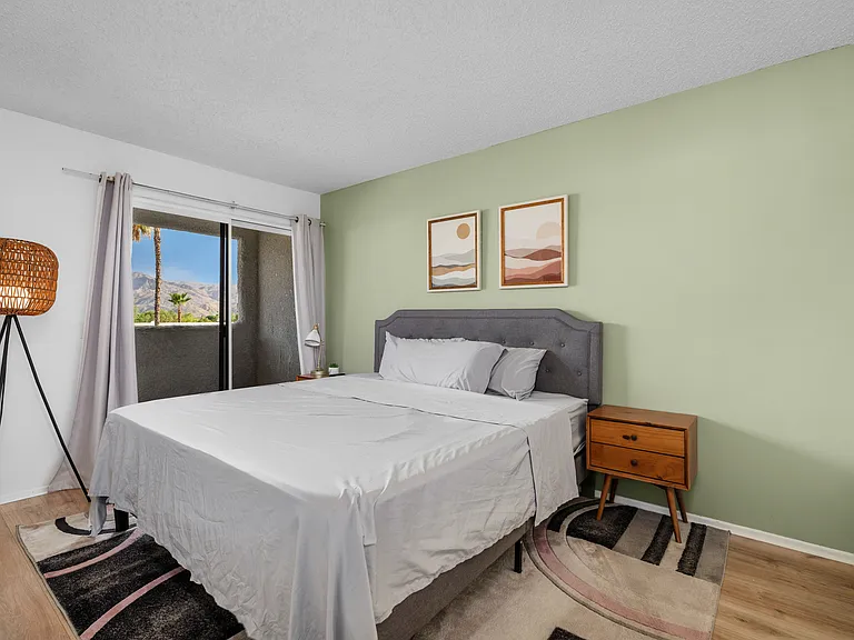 Primary bedroom with balcony and en suite
