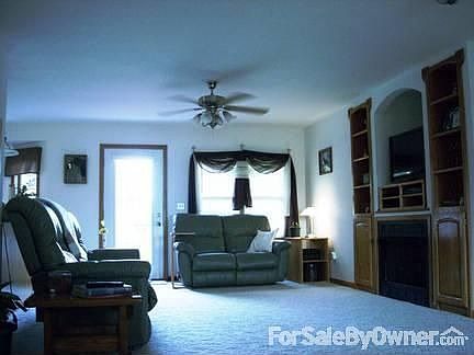 Living Room
						:
						Main level, built in entertainment center w/ storage surrounding gas fireplace.