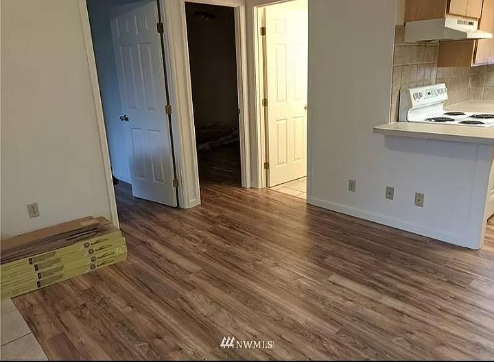 Living room space with Luxury Vinyl Plank flooring and new doors.