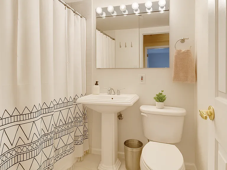 Bright, clean, and simple_this bathroom with tub offers a fresh space to reset and refresh after a full day of exploring or working.