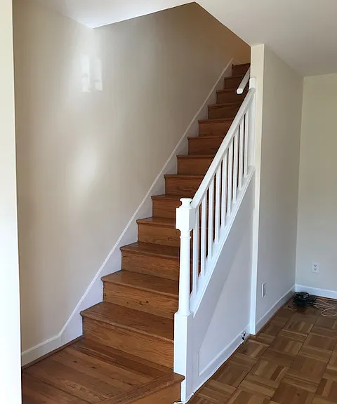 Stairway to upper level with original trim