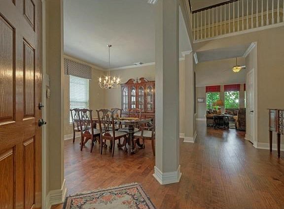 As you enter, you will love all of the architectural details found throughout this impressive home.