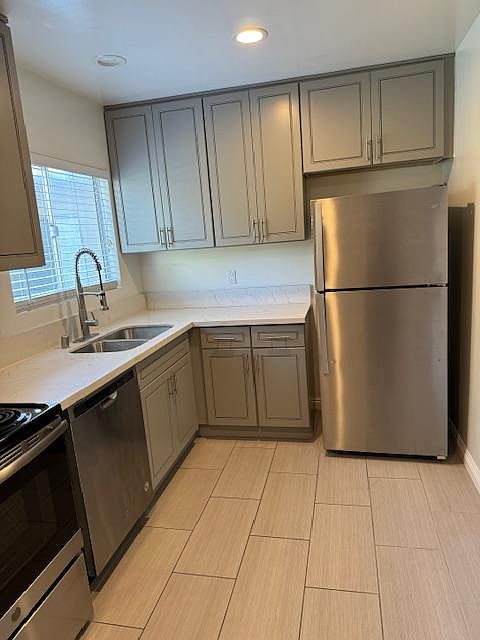 Full-size Stainless Refrigerator, Range, Dishwasher and Built-in Microwave