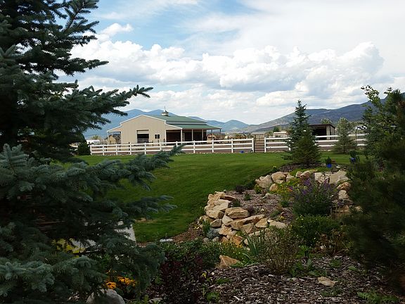 view of barn from rock garde