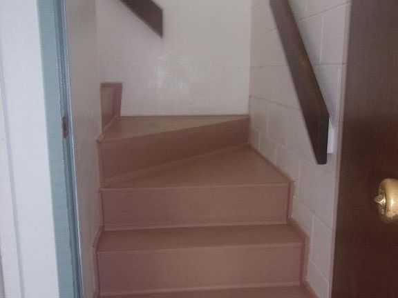 interior stairs from carport to upstairs unit