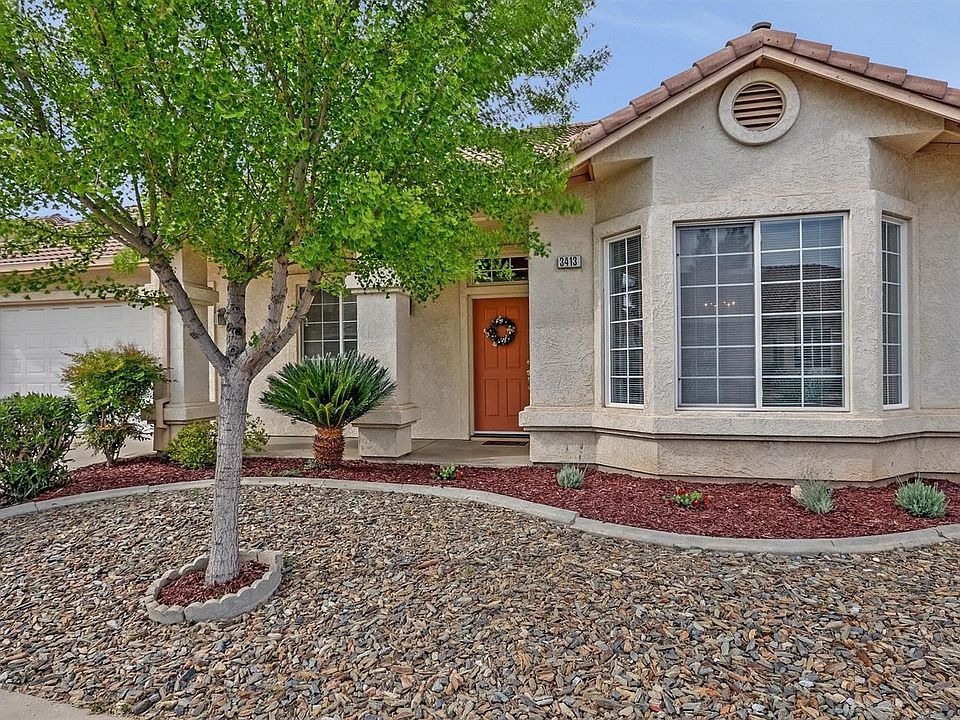 DESIRABLE SINGLE STORY HOME WITH LOW MAINTENANCE LANDSCAPE