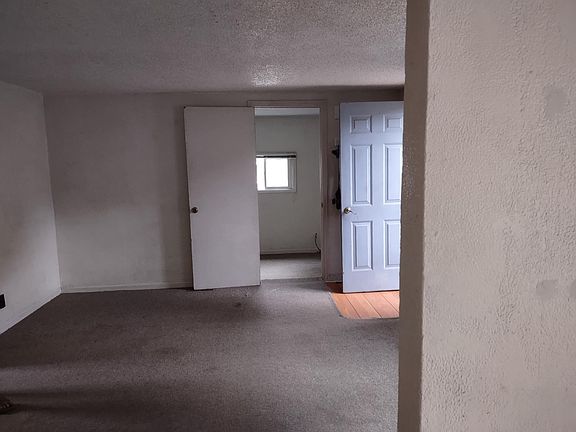 Diningroom looking into livingroom and a bedroom