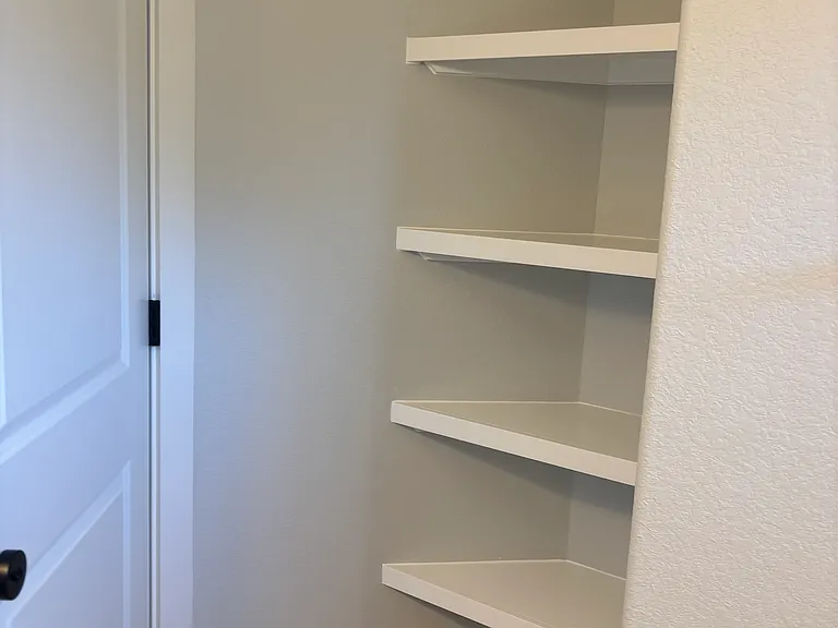 Linen Storage shelving in Guest Bath