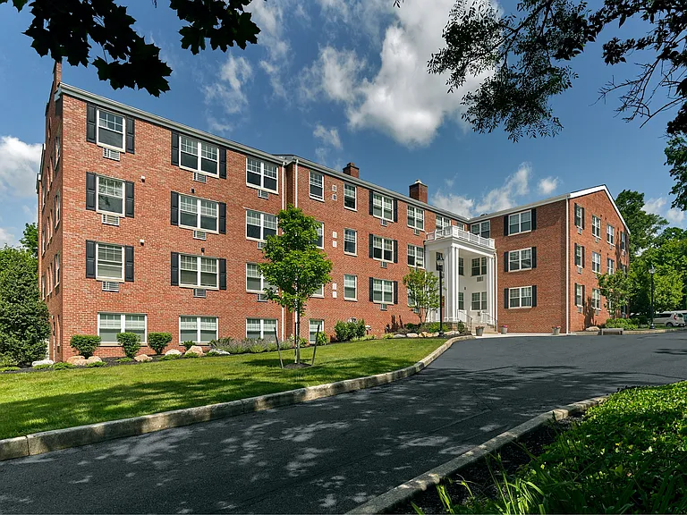 Crestwood Apartments in Wayne, PA _ Expansive view of beautifully landscaped grounds and classic red brick exterior