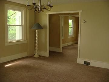 Dining room looking toward the living room. Now has new floor in place of carpet