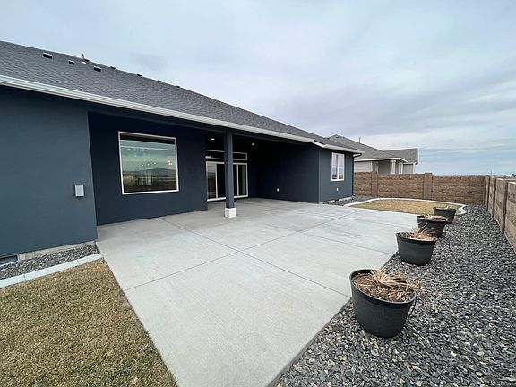 Expansive concrete for easy maintenance and lots of tell for outdoor entertaining