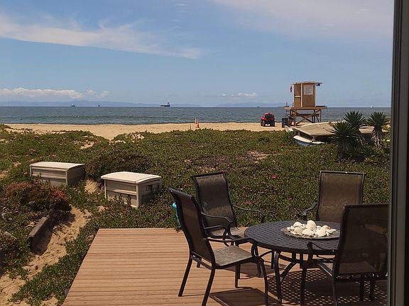 On the sand. Private path to the beach for the property and next door.
