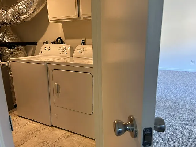 Private laundry room on lower bedroom level.
