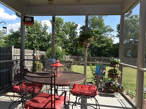 Enjoy the breeze and the shade from the screened-in porch.